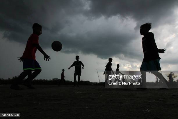 The Dark clouds are seen covering the sky of Lhokseumawe city, Aceh, Indonesia on June 28, 2018. According to the Meteorology Climatology and...