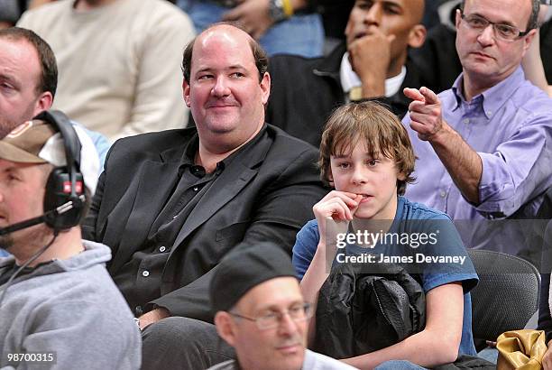 Brian Baumgartner and guest attend the Chicago Bulls vs New York Knicks game at Madison Square Garden on December 22, 2009 in New York City.