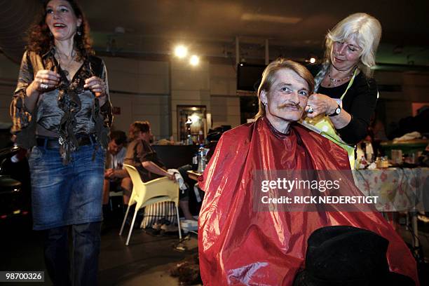 Homeless person gets a haircut during a party organised for the homeless, in Tivoli, Utrecht, on April 27, 2010. Homeless people are treated to nice...