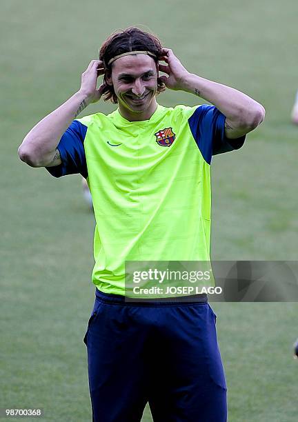 Barcelona's Swedish forward Zlatan Ibrahimovic smiles during a training session on the eve of his team's UEFA Champions League football match against...