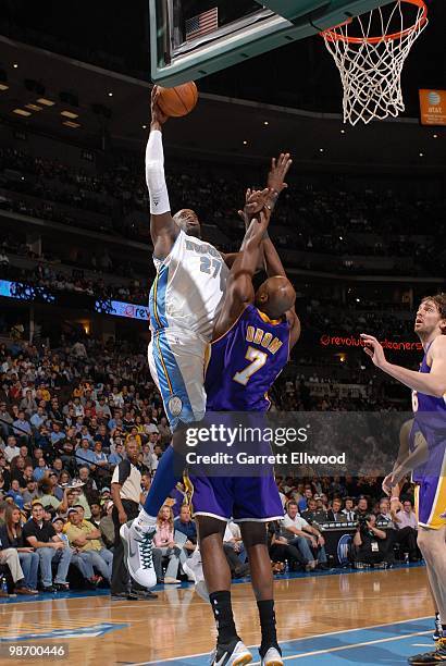 Johan Petro of the Denver Nuggets goes up for a jump shot against Lamar Odom of the Los Angeles Lakers during the game at Pepsi Center on April 8,...