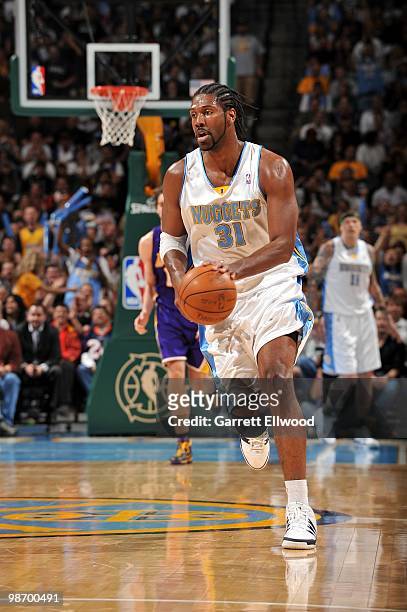Nene of the Denver Nuggets dribbles the ball through mid-court against the Los Angeles Lakers during the game at Pepsi Center on April 8, 2010 in...