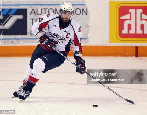 Harry Young of the Windsor Spitfires gets set to make a pass in Game 6 of the Western Conference Final against the Kitchener Rangers on April 23,...