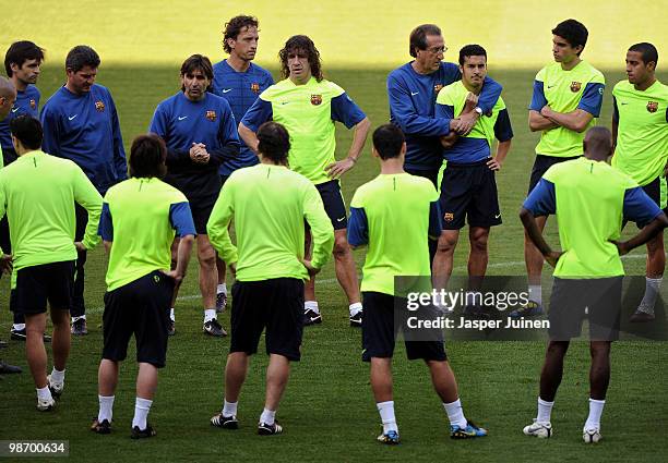 Carles Puyol of FC Barcelona stands with his teammates during a training session ahead of their UEFA Champions League semi final second leg match...