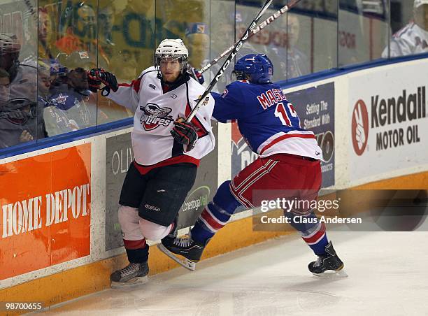 Ryan Ellis of the Windsor Spitfires eludes a hit from Mike Mascioli of the Kitchener Rangers in Game 6 of the Western Conference Final on April 23,...