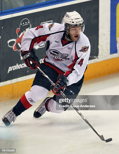 Taylor Hall of the Windsor Spitfires skates with the puck in Game 6 of the Western Conference Final against the Kitchener Rangers on April 23, 2010...