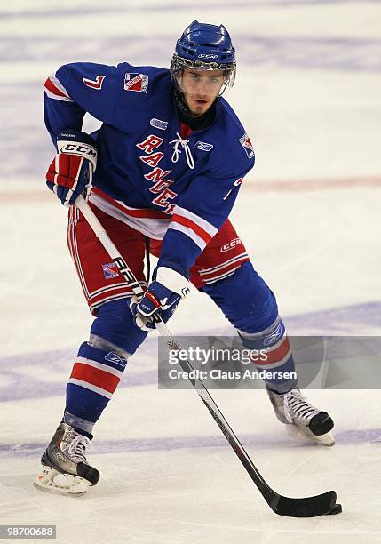 John Moore of the Kitchener Rangers skates with the puck in Game 6 of the Western Conference Final against the Windsor Spitfires on April 23, 2010 at...