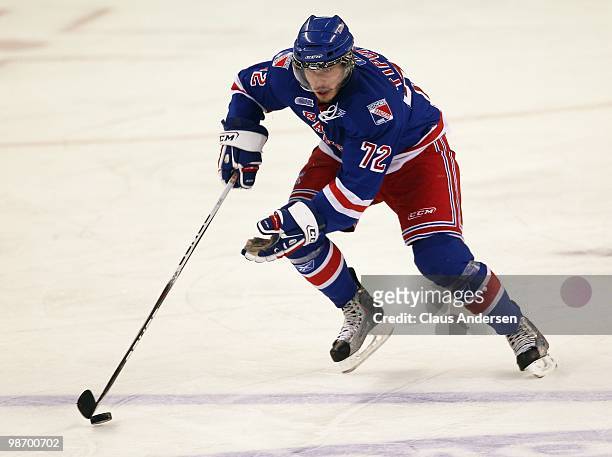 Matthew Tipoff of the Kitchener Rangers skates with the puck in Game 6 of the Western Conference Final against the Windsor Spitfires on April 23,...