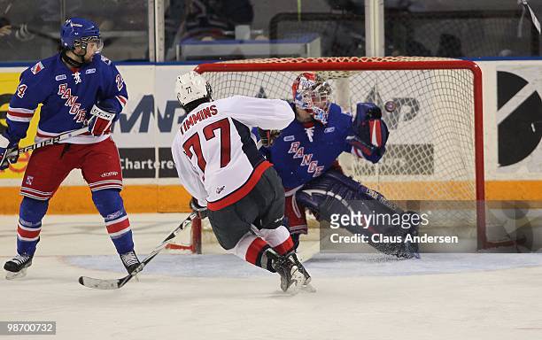 Scott Timmins of the Windsor Spitfires beats Brandon Maxwell of the Kitchener Rangers for one of his 3 goals in Game 6 of the Western Conference...