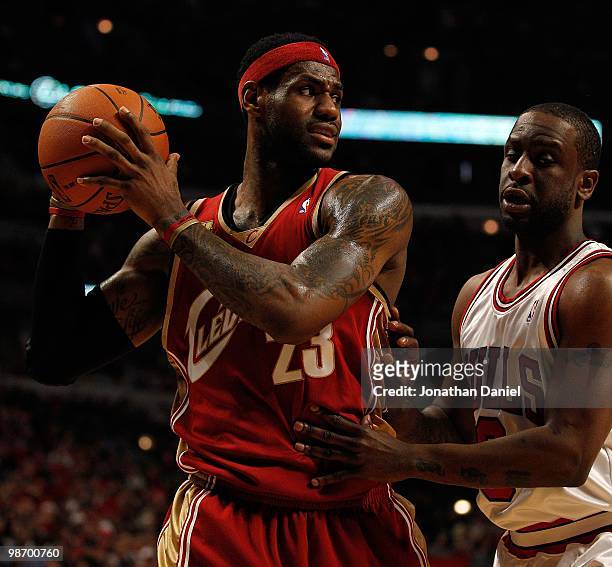 LeBron James of the Cleveland Cavaliers looks to pass around Ronald Murray of the Chicago Bulls in Game Four of the Eastern Conference Quarterfinals...