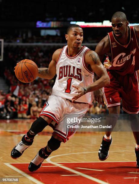 Derrick Rose of the Chicago Bulls drives around Antawn Jamison of the Cleveland Cavaliers in Game Four of the Eastern Conference Quarterfinals during...