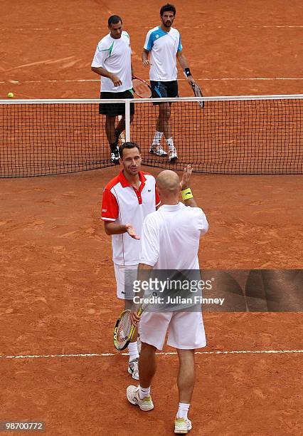 Ivan Ljubicic of Croatia and Michael Llodra of France defeat Julian Knowle of Austria and Andy Ram of Israel in the doubles during day three of the...