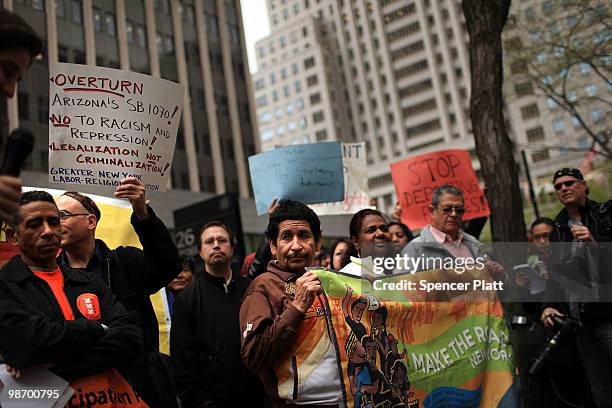 Immigrants, activists and supporters of illegal immigrants rally against a new Arizona law on April 27, 2010 outside of Federal Plaza in New York...