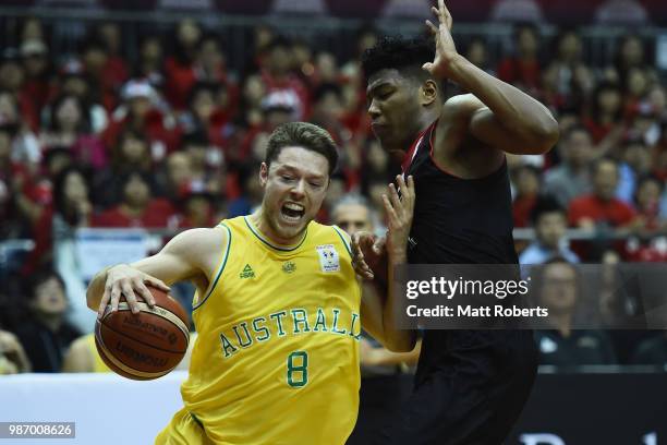 Matthew Dellavedova of Australia takes on the defence of Rui Hachimura of Japan during the FIBA World Cup Asian Qualifier Group B match between Japan...