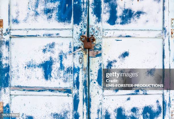 old weathered wooden door. - broken padlock stock pictures, royalty-free photos & images