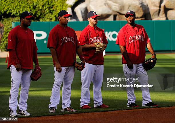 Bobby Abreu Juan Rivera 2 Mike Napoli and Torii Hunter of the Los Angeles Angels of Anaheim look on during batting practice before the start of the...