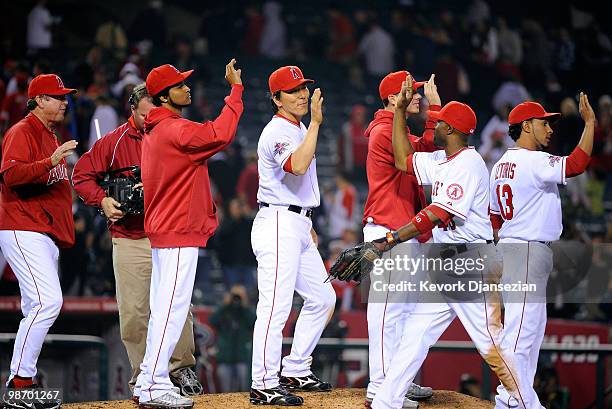 Japanese designated hitter Hideki Matsui of the Los Angeles Angels of Anaheim high five teammate Torii Hunter after defeating Cleveland Indians on...