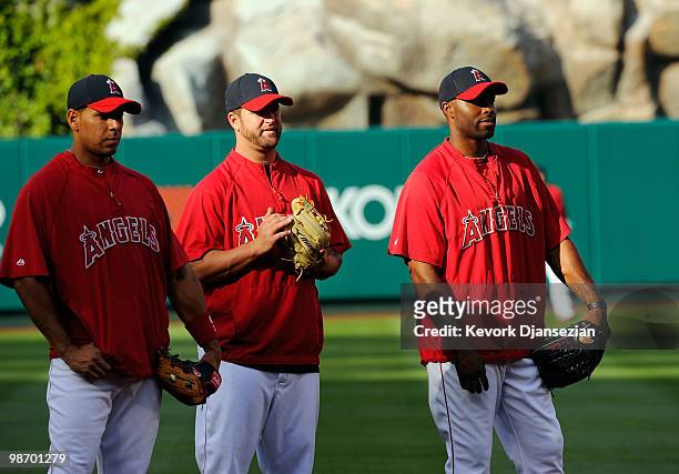 Juan Rivera Mike Napoli and Torii Hunter of the Los Angeles Angels of Anaheim look on during batting practice before the start of the baseball game...
