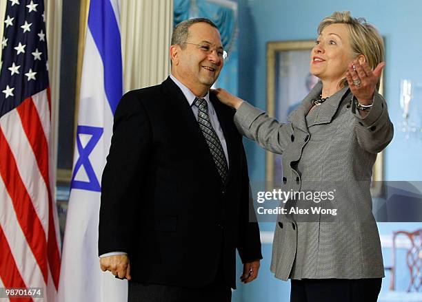 Secretary of State Hillary Clinton speaks to the media as Israeli Defense Minister Ehud Barak listens after a meeting at the State Department April...