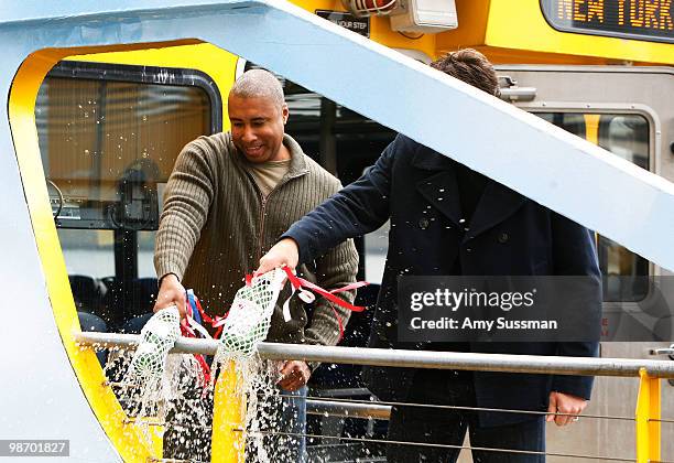 Former New York Yankee Bernie Williams and New York Mets outfielder Jeff Francoeur attend the christening of "Delta's Baseball Water Taxis" at Pier...