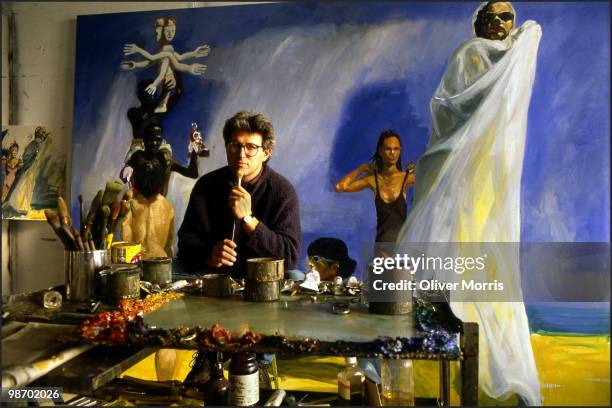 Portrait of American artist Eric Fischl as he poses in front of his painting 'A Brief History of North Africa' in his studio on Canal Street, New...