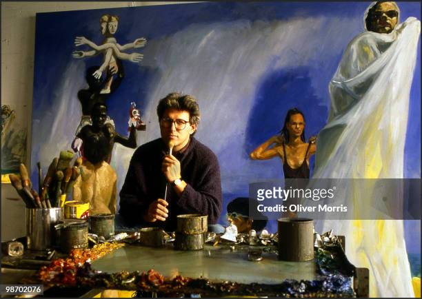 Portrait of American artist Eric Fischl as he poses in front of his painting 'A Brief History of North Africa' in his studio on Canal Street, New...