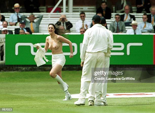 Streaker runs past the players during the fourth days play in the npower First Test Match between England and Pakistan at Lords Cricket Ground....