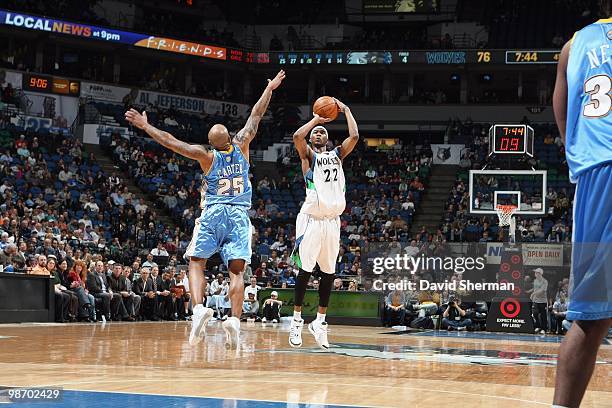 Corey Brewer of the Minnesota Timberwolves puts a shot up against Anthony Carter of the Denver Nuggets during the game on March 10, 2010 at the...