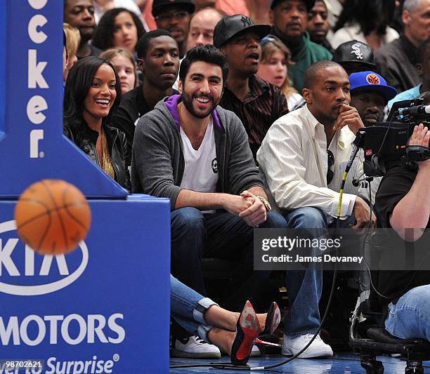 Selita Ebanks with guest and Anthony Mackie with guest attend a game between the Miami Heat and the New York Knicks at Madison Square Garden on April...