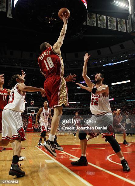 Anthony Parker of the Cleveland Cavaliers puts up a shot between Joakim Noah and Brad Miller of the Chicago Bulls in Game Four of the Eastern...