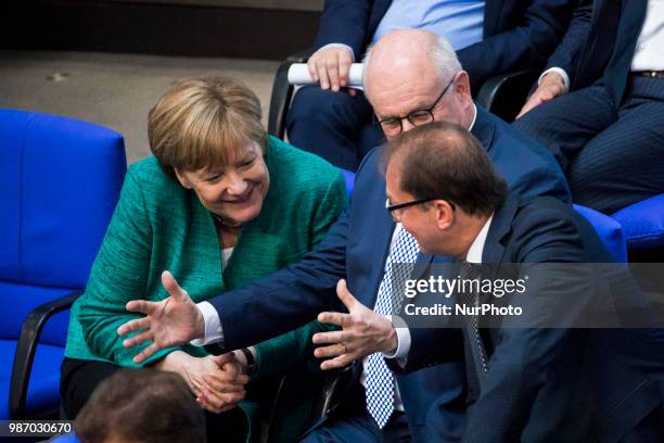 German Chancellor Angela Merkel speaks with Parliamentary group leader of CDU/CSU Volker Kauder and Bavarian CSU Fraction Leader Alexander Dobrindt...