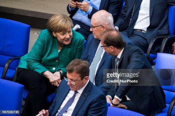 German Chancellor Angela Merkel speaks with Parliamentary group leader of CDU/CSU Volker Kauder and Bavarian CSU Fraction Leader Alexander Dobrindt...