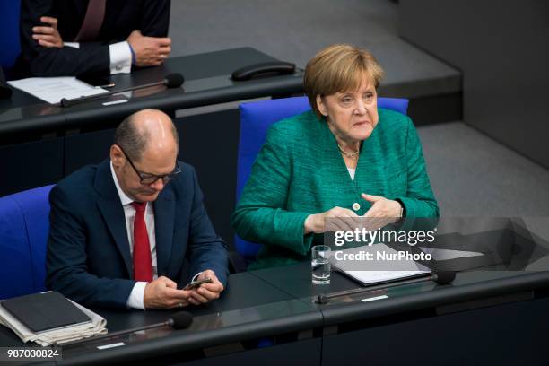 German Chancellor Angela Merkel and Finance Minister Olaf Scholz are pictured during the 42th Plenary Session of Bundestag German Lower House of...