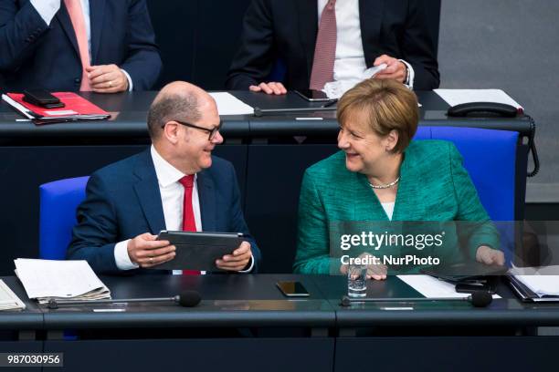 German Chancellor Angela Merkel and Finance Minister Olaf Scholz are pictured during the 42th Plenary Session of Bundestag German Lower House of...