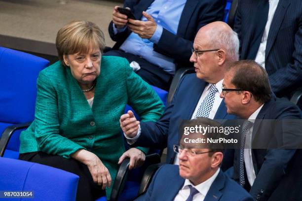German Chancellor Angela Merkel speaks with Parliamentary group leader of CDU/CSU Volker Kauder and Bavarian CSU Fraction Leader Alexander Dobrindt...