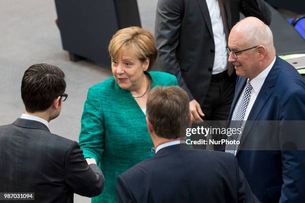 German Chancellor Angela Merkel greets Parliamentary group leader of CDU/CSU Volker Kauder during the 42th Plenary Session of Bundestag German Lower...