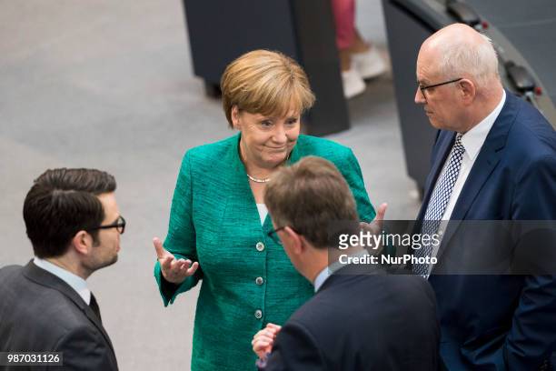 German Chancellor Angela Merkel greets Parliamentary group leader of CDU/CSU Volker Kauder during the 42th Plenary Session of Bundestag German Lower...