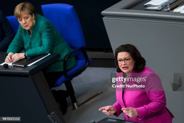 German Chancellor Angela Merkel listens to Chairwoman of the Social Democratic Party Andrea Nahles as she speaks during the 42th Plenary Session of...