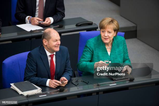 German Chancellor Angela Merkel and Finance Minister Olaf Scholz are pictured during the 42th Plenary Session of Bundestag German Lower House of...