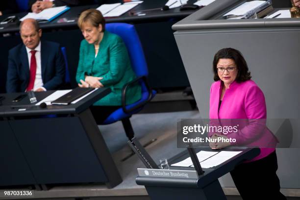 German Chancellor Angela Merkel and Finance Minister Olaf Scholz listen to Chairwoman of the Social Democratic Party Andrea Nahles as she speaks...