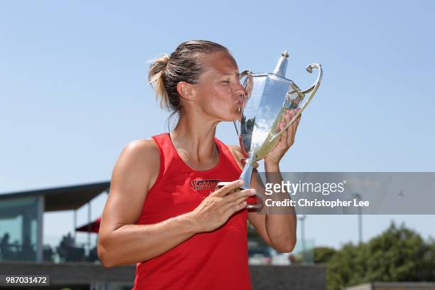 Kirsten Flipkins of Belgium poses with the Winners Trophies after her victory over Katie Boulter of Great Britain in the Womens Singles Final match...
