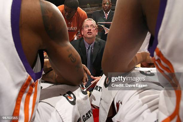 Head coach Nick Nurse of the Iowa Energy huddles with his teammates during the game against the Tulsa 66ers in Game Three of the Semifinal series of...