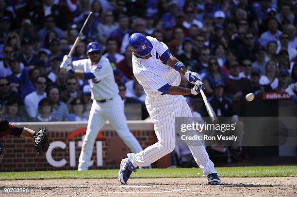 Derrek Lee of the Chicago Cubs hits a three run home run in the seventh inning against the Houston Astros on April 16, 2010 at Wrigley Field in...