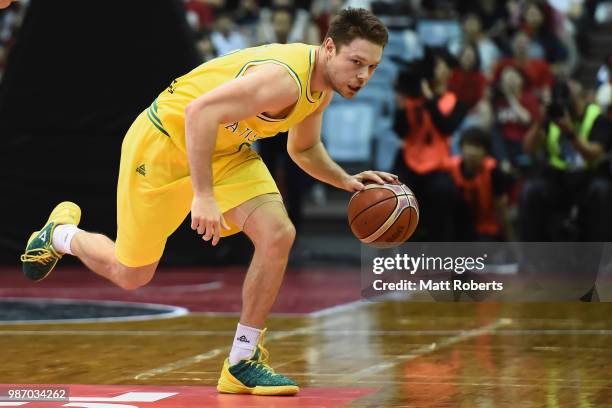 Matthew Dellavedova of Australia controls the ball during the FIBA World Cup Asian Qualifier Group B match between Japan and Australia at Chiba Port...