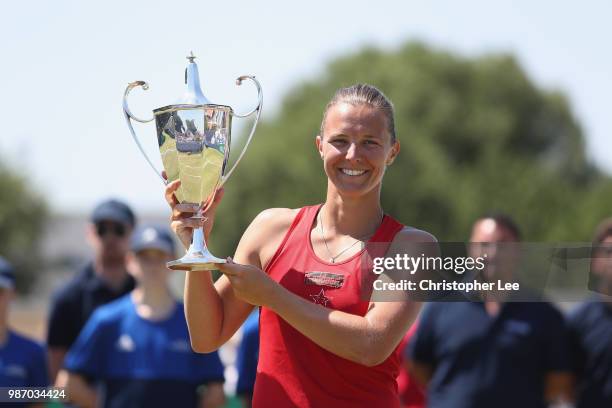 Kirsten Flipkins of Belgium poses with the Winners Trophy after her victory over Katie Boulter of Great Britain in the Womens Singles Final match...