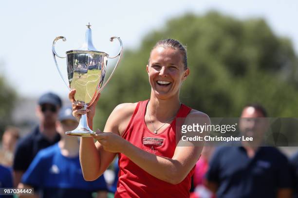 Kirsten Flipkins of Belgium poses with the Winners Trophy after her victory over Katie Boulter of Great Britain in the Womens Singles Final match...
