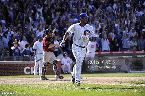 Derrek Lee of the Chicago Cubs hits a three run home run in the seventh inning against the Houston Astros on April 16, 2010 at Wrigley Field in...