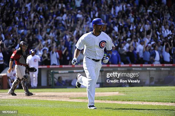 Derrek Lee of the Chicago Cubs hits a three run home run in the seventh inning against the Houston Astros on April 16, 2010 at Wrigley Field in...