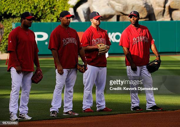 Bobby Abreu, Juan Rivera, Mike Napoli and Torii Hunter of the Los Angeles Angels of Anaheim look on during batting practice before the start of the...
