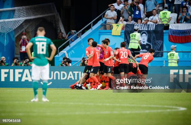 Players of South Korea celebrate while Joshua Kimmich of Germany looks dejected after South Korea scored the first goal during the 2018 FIFA World...